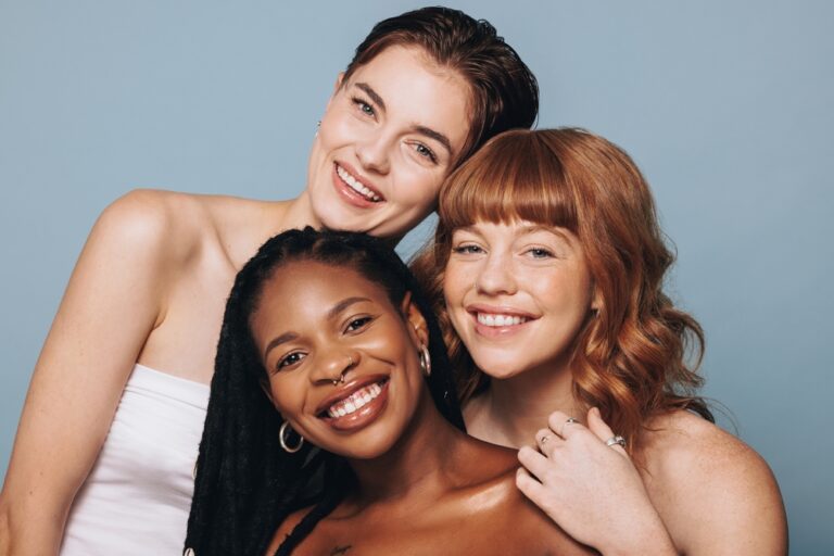 Portrait,Of,Women,With,Different,Skin,Tones,Smiling,At,The